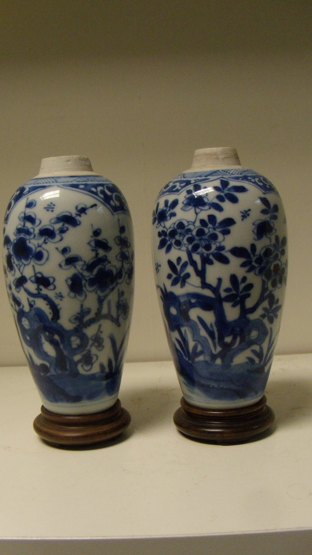 Two similar blue and white vases, period of Kangxi, each of the ovoid bodies painted with two