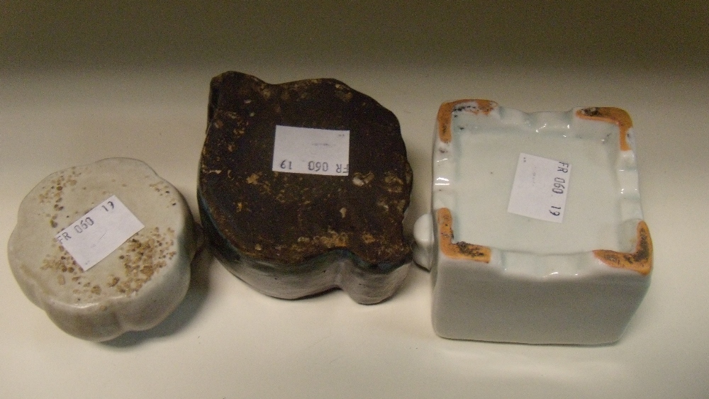 Three 19th century Korean water droppers, the square top of the white glazed example moulded with - Image 2 of 2