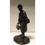 A Meiji period (1868-1912) bronze figure of a singing man standing with a lamp in one hand and a