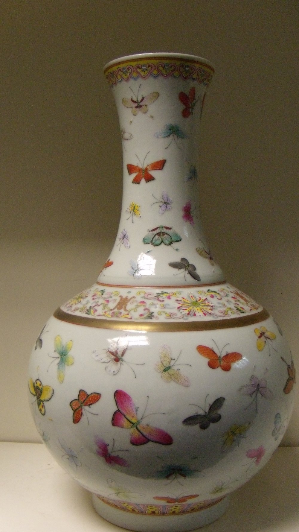 A 19th century famille rose bottle vase, six character mark of Guangxu, ruyi lappets in a band on - Image 2 of 4