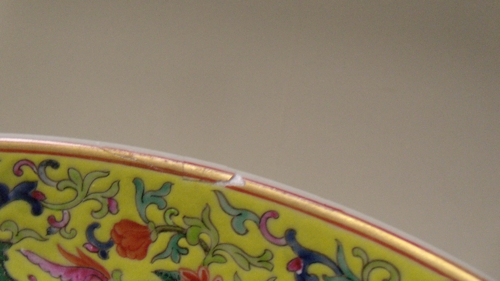 A yellow ground dish, painted with flowers scrolling around the central gilt shou character within - Image 4 of 4