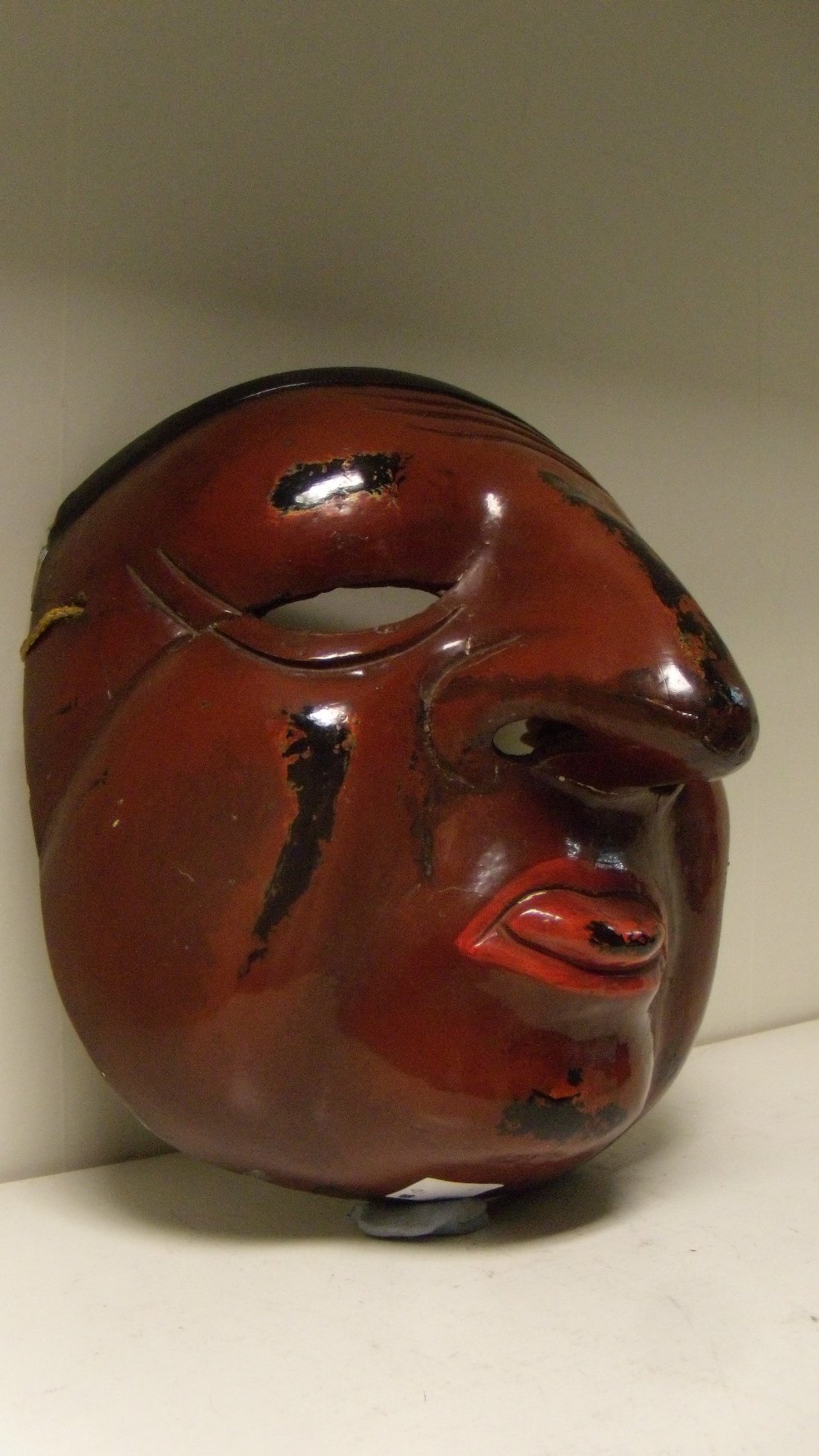 A lacquer mask, possibly of Shin Sotoku, a red tongue protuding from the brown face with black hair, - Image 2 of 4
