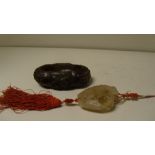 A 19th century grey hardstone pomander/pendant and a soapstone brush washer, the shell shape of
