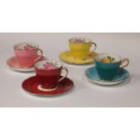 Eleven Adderley 'Rose' porcelain tea cups and saucers together with an Aynsley childrens plate