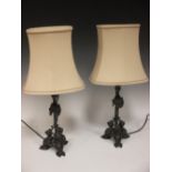 A pair of spelter 'armour' shaped base table lamps, 55cm high