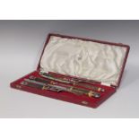 A cased five piece bone handled carving set