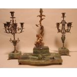 An onyx inkwell and pair of matched candelabra together with a modern lamp with putti at base and