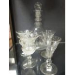 A George III decanter and stopper together with a pair of thistle shaped glasses and another pair (