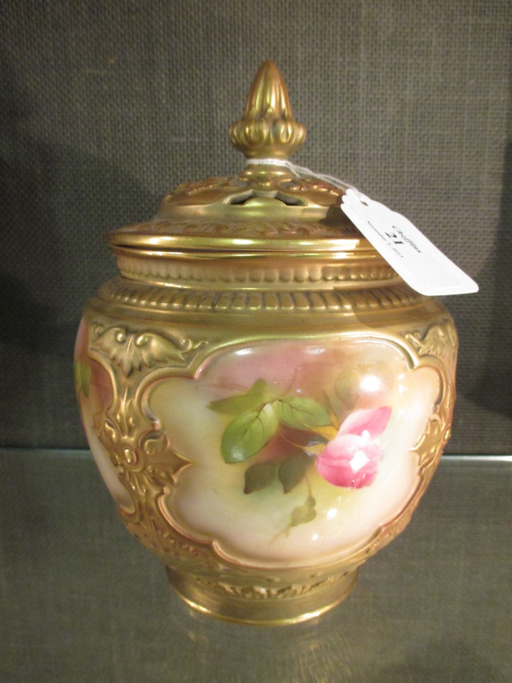 An early 20th century Worcester pot pourri vase and cover painted with roses, 18cm high