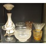 Four various glass vases, two champagnes vases and an oil lamp