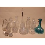 A collection of eleven cut glass and other decanters