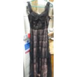 A lady's full length black lace dress