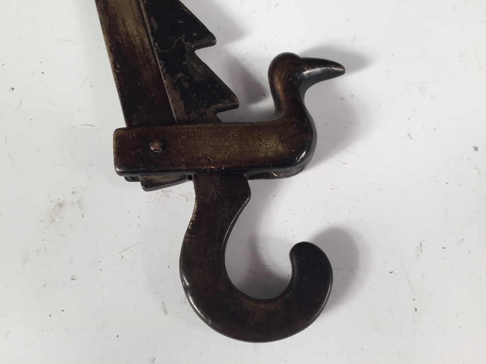 A late 18th/early 19th century brass adjustable pot hook, opposing hooks at each end, the saw - Image 2 of 3