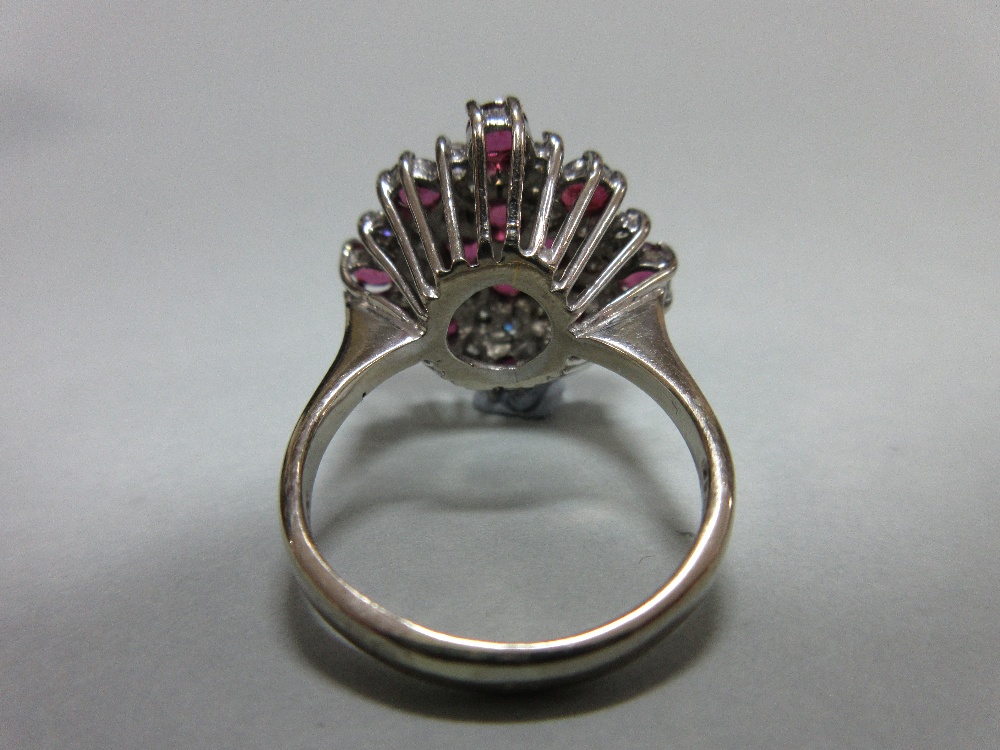 A ruby and diamond cluster ring in 18ct white gold, designed as a densely set diaper with a - Image 6 of 6