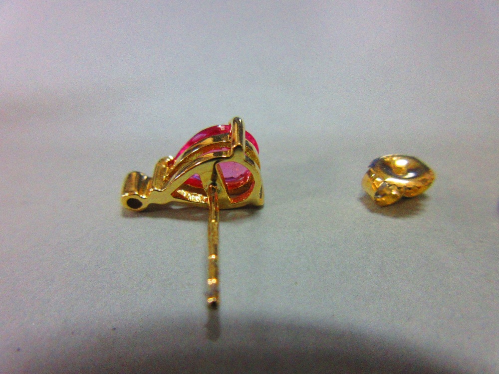 A pair of pink sapphire, diamond and 18ct gold earstuds, each post headed by a three claw set pear - Image 3 of 5