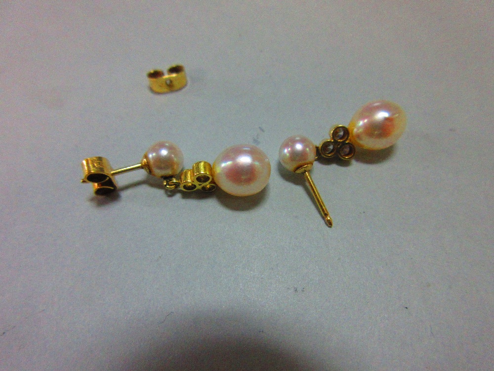 A pair of pearl and diamond earpendants cased by Garrard, each post headed by a 5mm pearl and - Image 3 of 3