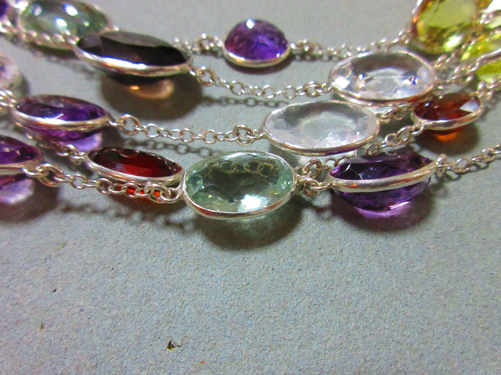 A five strand multi gemset necklace, composed of oval cut hessonite garnets, prasiolites, amethysts, - Image 6 of 7