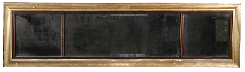 An early 19th century gilt framed triple plate overmantle mirror, with ebonised reeded borders and