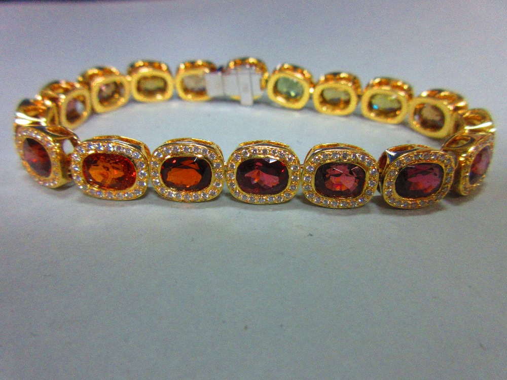 A multi gem set and diamond bracelet, each of the eighteen oval cut stones set in a border of - Image 2 of 8