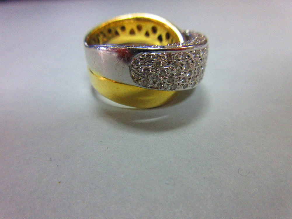 A modern diamond crossover band ring, of precious metal stamped '750' and designed as a plain - Image 5 of 6