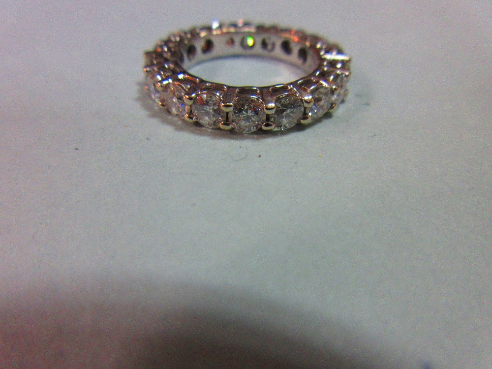 A diamond full hoop eternity ring, set with eighteen round brilliant cut diamonds in white - Image 4 of 5