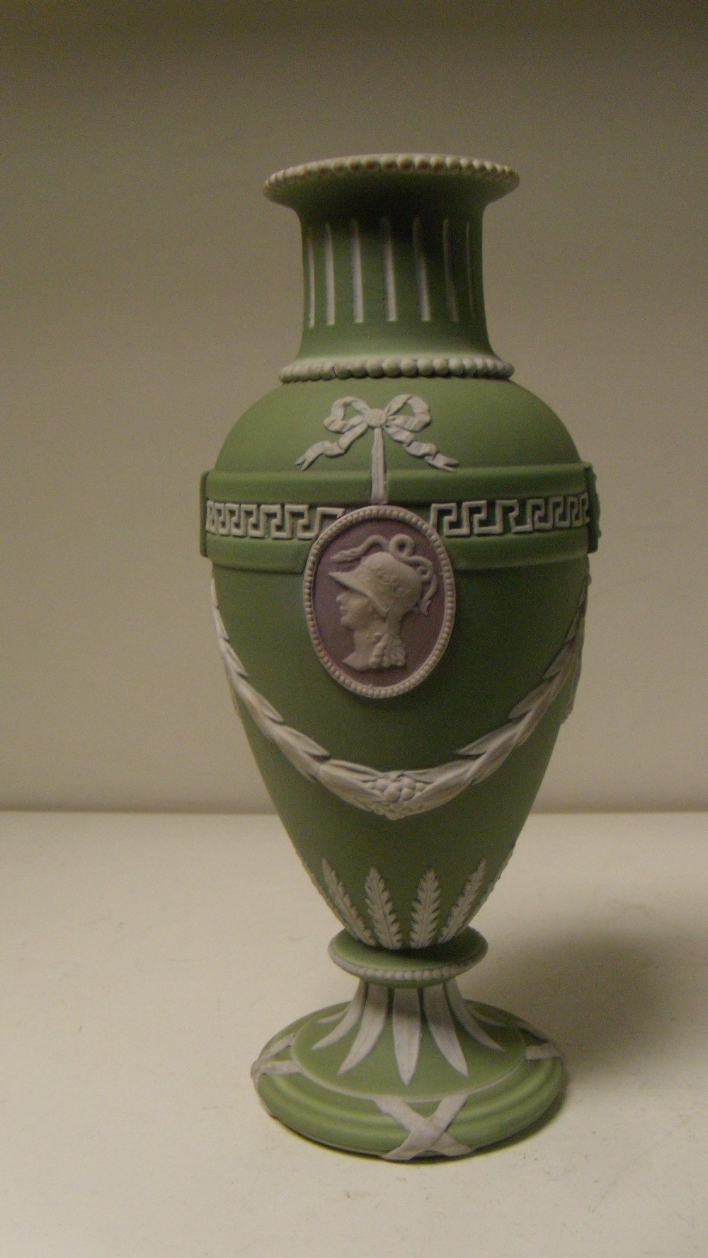 A Wedgwood three colour jasper vase, the green ovoid body with two classical profiles in white on - Image 2 of 3