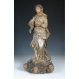An 18th century carved wood polychrome figure of the Madonna, possibly Spanish, she wears a blue