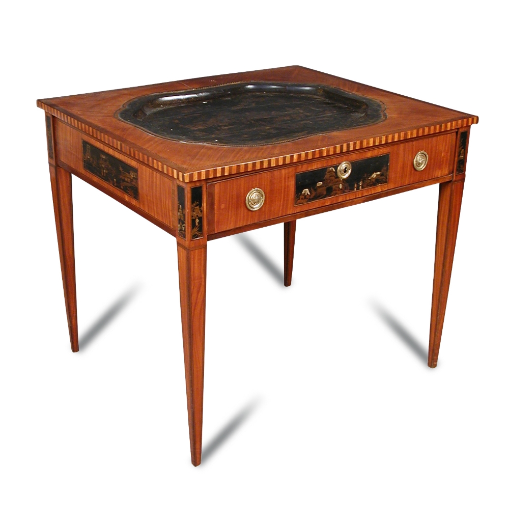 A late 18th century Continental mahogany and satinwood table, inset with a lacquer tray decorated