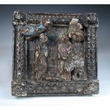 A 16th century Continental carved chestnut and polychrome decorated panel of the Nativity, the