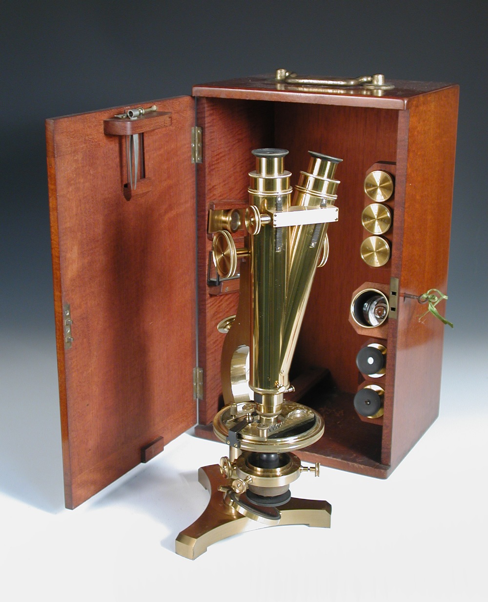 A good 19th century lacquered brass binocular microscope by R. & J. Beck, No. 19432, with rack and