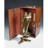 A good 19th century lacquered brass binocular microscope by R. & J. Beck, No. 19432, with rack and