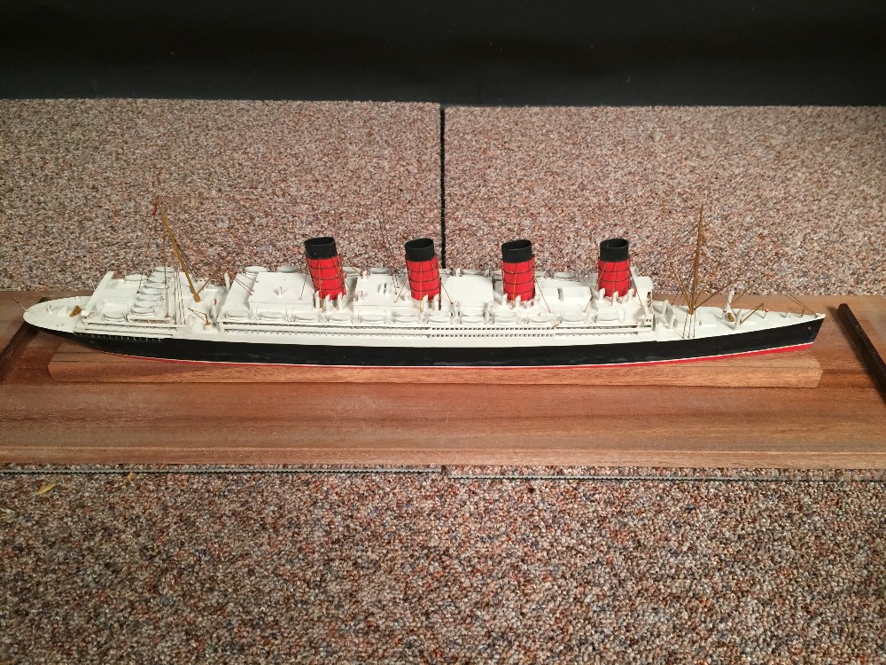 A mid 20th century painted wood model of a four-funnel passenger ship, mounted within a glazed - Image 2 of 4