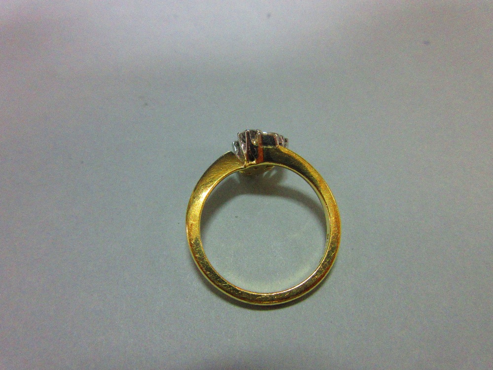 An asymmetric diamond ring set in 18ct gold, designed with two principal round brilliant cut - Image 2 of 5