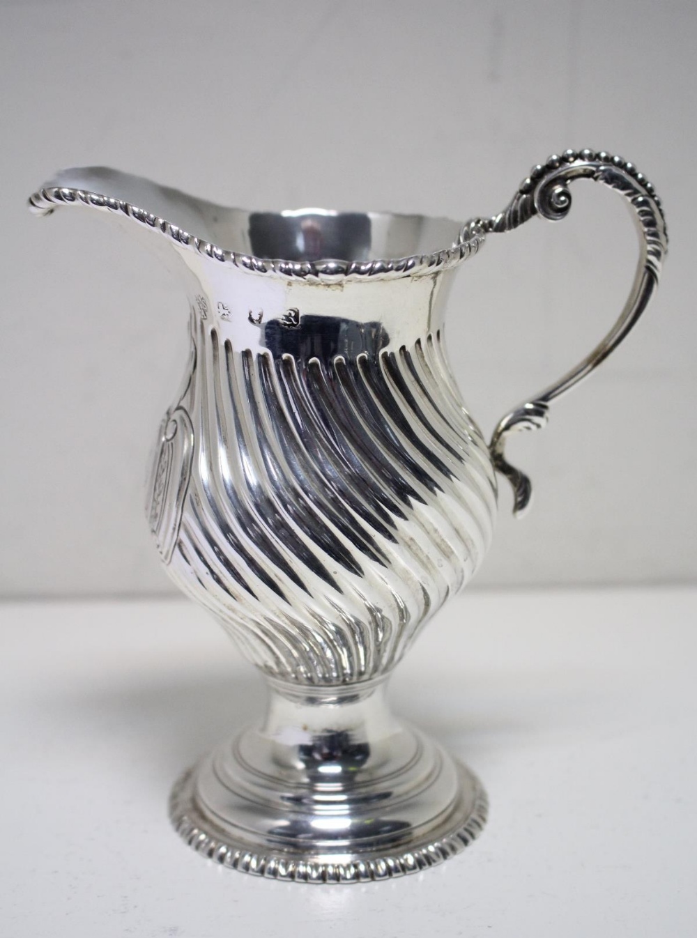 A George III silver creamer by Nathaniel Appleton & Ann Smith, London 1772, pyriform, the body - Image 3 of 5