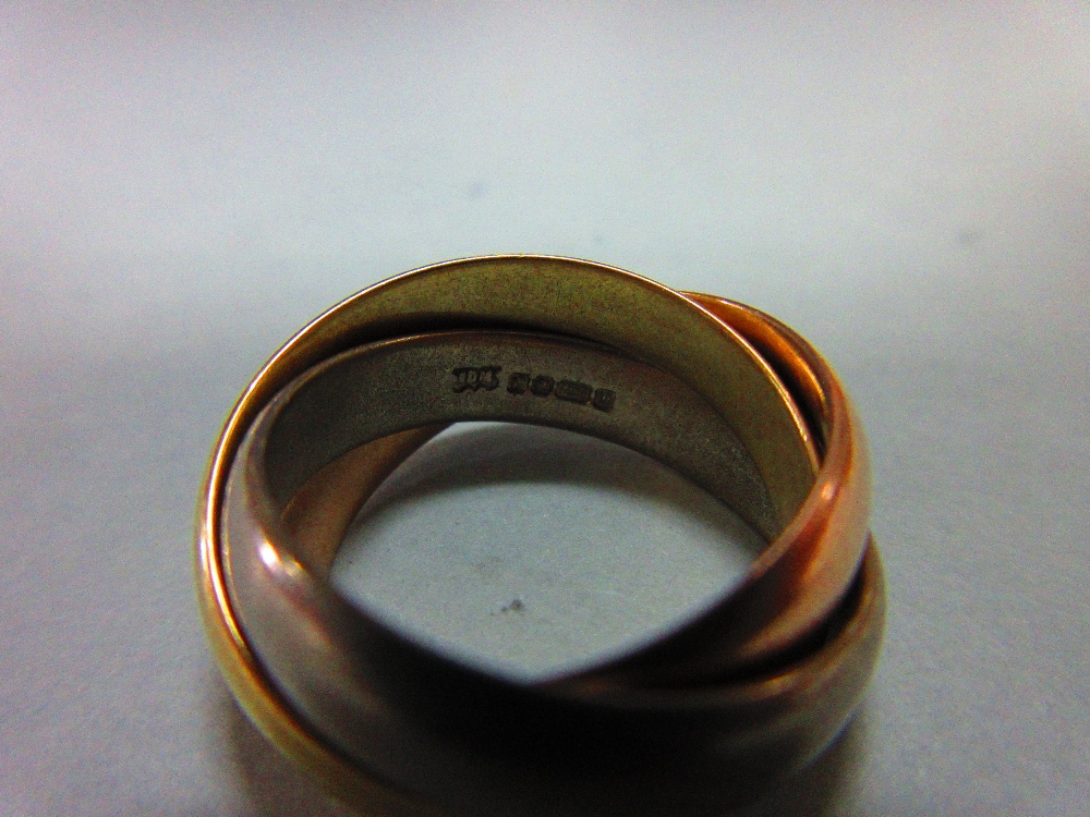 An 18ct three colour gold 'Russian wedding' ring, the three interlocking plain D-section bands, - Image 2 of 5