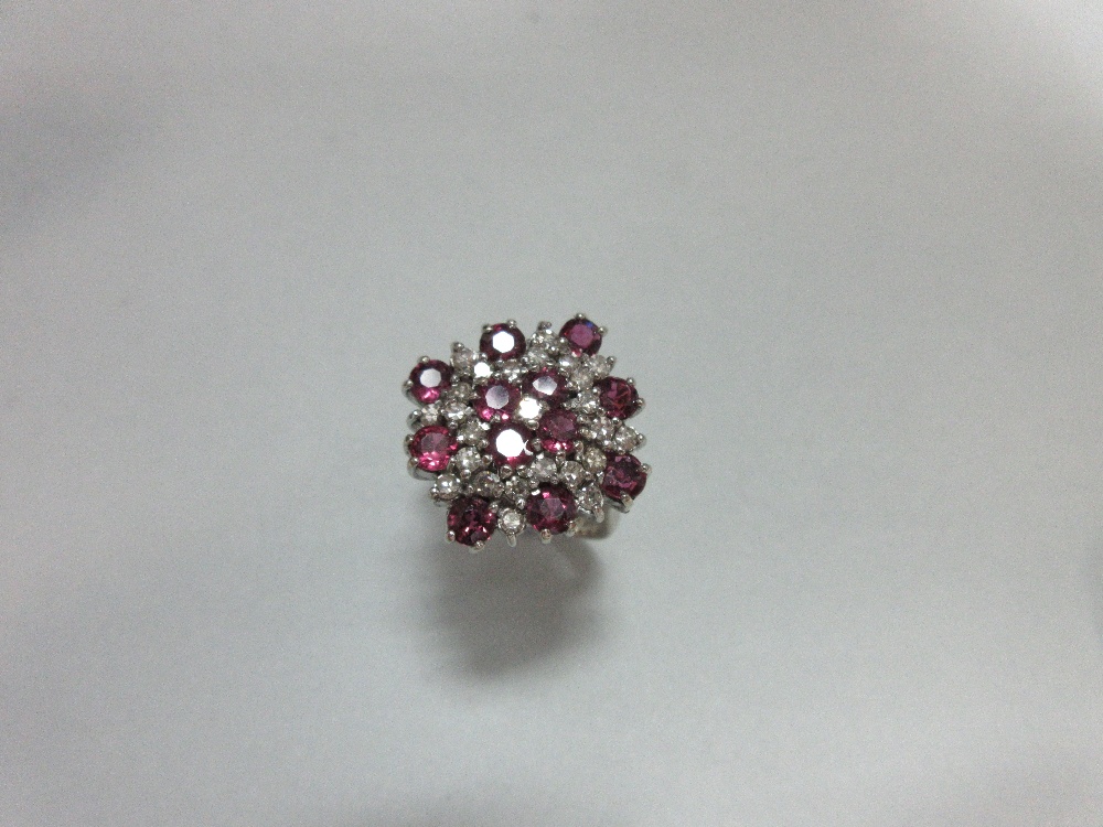 A ruby and diamond cluster ring in 18ct white gold, designed as a densely set diaper with a - Image 2 of 6