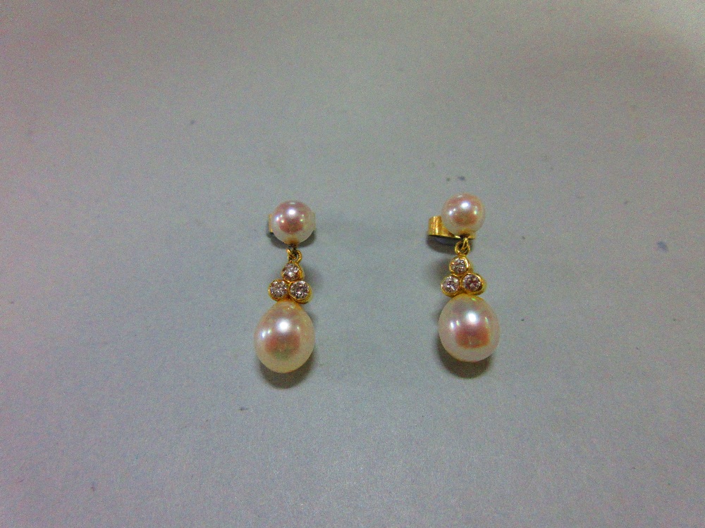 A pair of pearl and diamond earpendants cased by Garrard, each post headed by a 5mm pearl and - Image 2 of 3