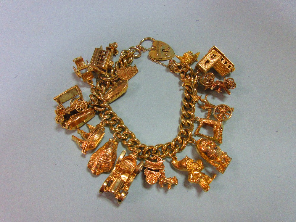 A 9ct gold charm bracelet with 17 charms, the substantial curb link bracelet, hallmarked Sheffield