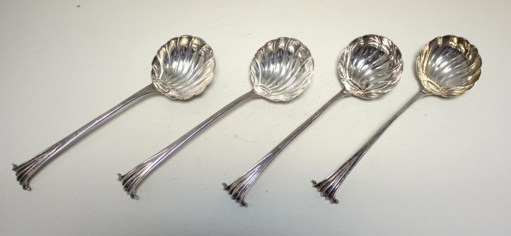 A matched set of George II/III silver Onslow pattern sauce ladles, all with shell bowls, one by