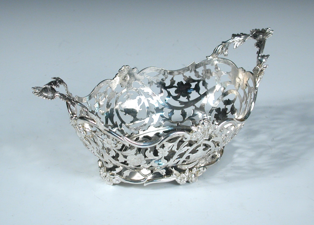 A small Dutch metalwares sweetmeat basket, bearing marks for Amsterdam 1851, of oval shape the