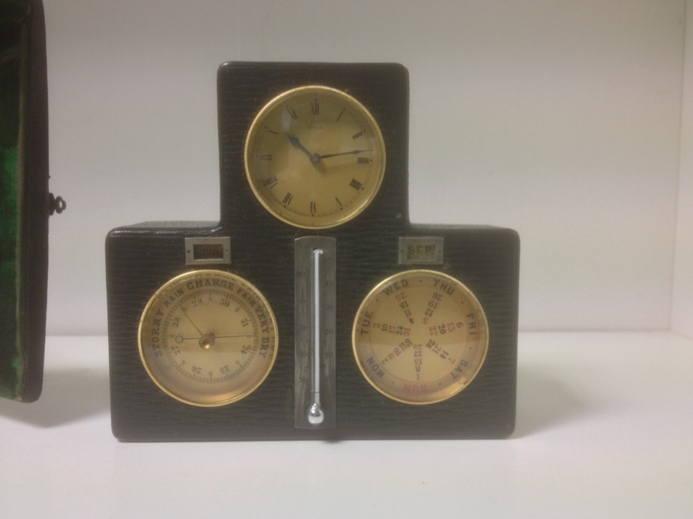 A Swiss leather cased desk timepiece with calendar and barometer, mounted with central silvered - Image 2 of 5