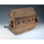 A late 19th or early 20th century pine model of Noah's Ark, the sliding back opening to reveal an
