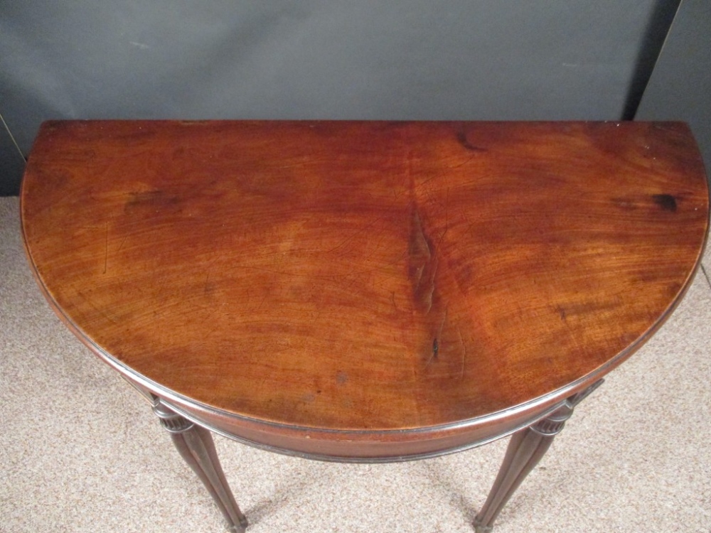 A George IV mahogany demi lune card table, with foldover top, green velvet lined interior, on - Image 3 of 5