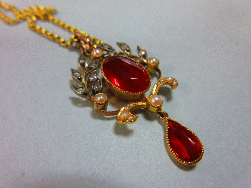 A belle époque fire opal, diamond and seed pearl pendant with chain, the oval cut fire opal collet - Image 4 of 4