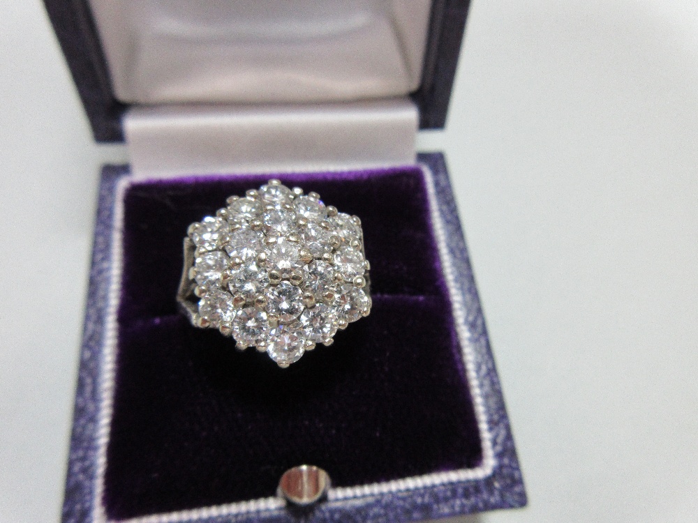 A diamond cluster ring set in 18ct gold, closely set with nineteen round brilliant cut diamonds in a - Image 6 of 6