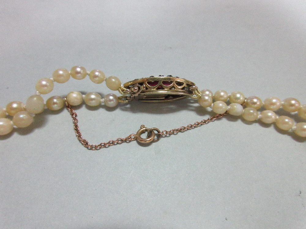 A two row pearl necklace with ruby and diamond clasp, the 3.6 - 8.0mm graduated pearls, to a navette - Image 2 of 7