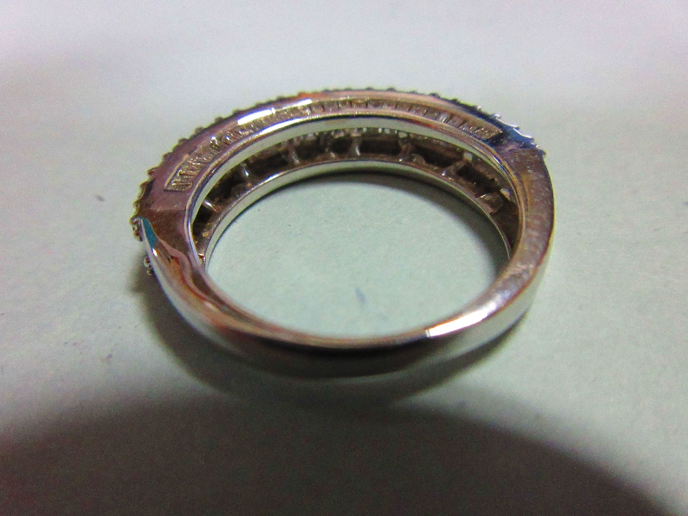 A white gold and diamond half hoop ring, with a channel set line of baguette cut diamonds between - Image 4 of 6