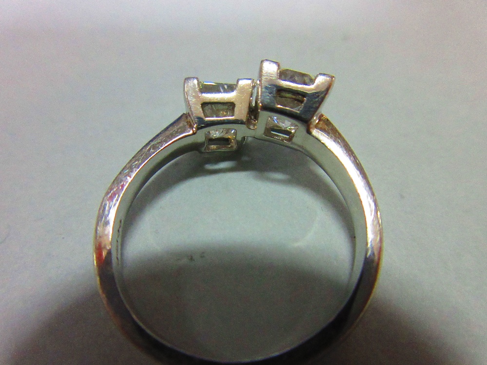 A certificated two stone princess cut diamond and platinum ring, the two beautifully matched stones, - Image 4 of 12