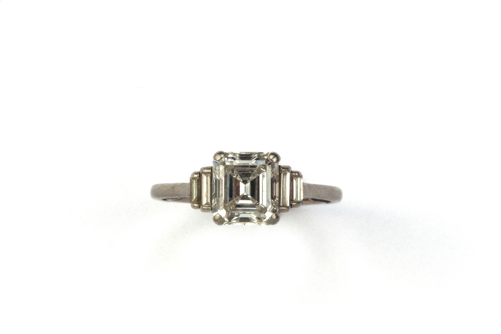 A diamond ring, the emerald cut principal stone, estimated weight 2.04cts, with two stepped baguette - Image 2 of 6