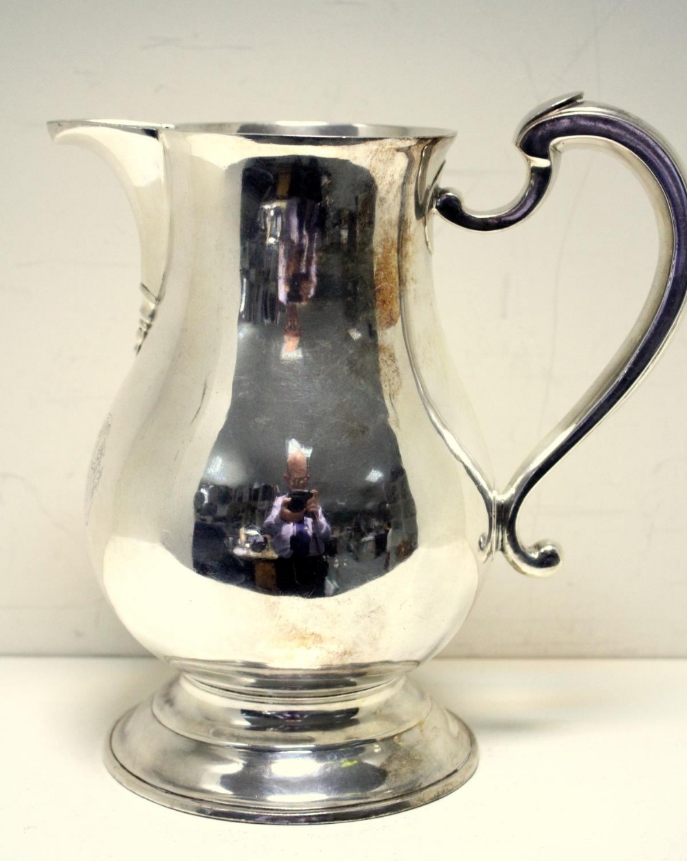 A George II silver ale jug, by Jonathan Fossy, London 1742, of plain baluster form over a - Image 2 of 5